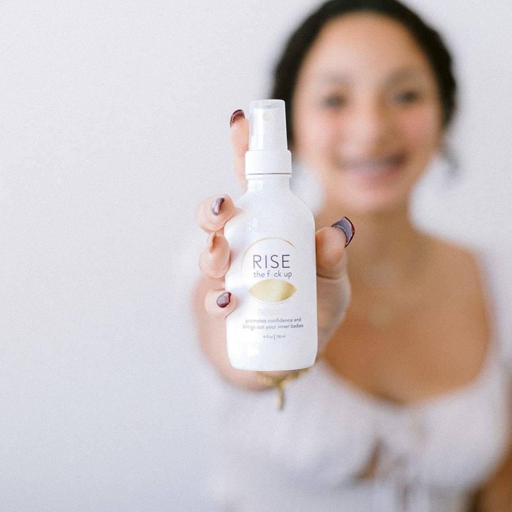 Rise The F*ck Up Theramist is made with organic grapefruit and cardamom essential oils, Flower Essences, and water.  It promotes confidence and brings out your inner badass.  This mist can be sprayed on yourself, in your office, or in your CEO workspace.  Shake well, spritz, and stand in your f*cking power, sister!